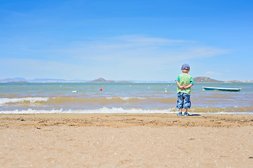 Image showing Small boy standing on the beach near Mar Menor
