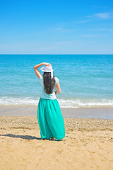 Image showing Brunette with long hair turned away