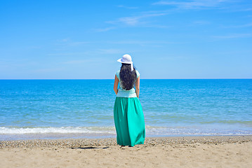 Image showing Brunette with long hair turned away