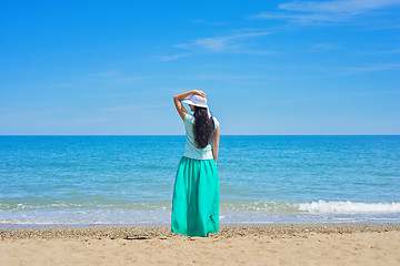 Image showing Brunette with long hair turned away