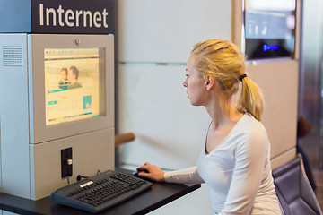 Image showing Woman public internet access point on airport.