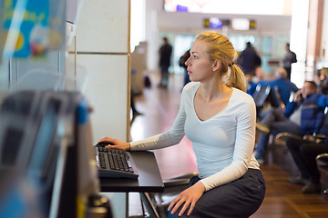 Image showing Woman public internet access point on airport.