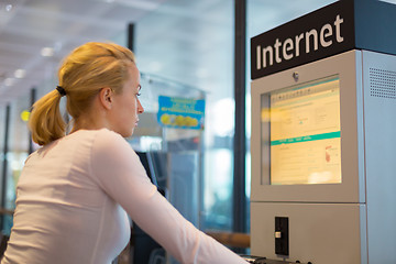 Image showing Woman public internet access point on airport.