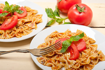 Image showing Italian pasta farfalle butterfly bow-tie and tomato sauce