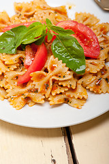 Image showing Italian pasta farfalle butterfly bow-tie and tomato sauce