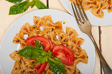 Image showing Italian pasta farfalle butterfly bow-tie and tomato sauce