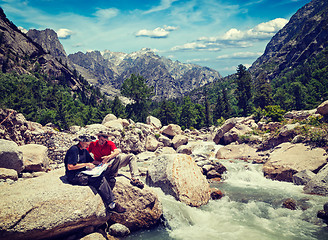 Image showing Hikers with map