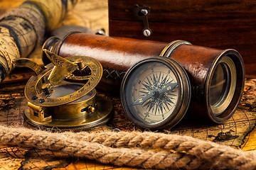 Image showing Old vintage compass and navigation instruments on ancient map