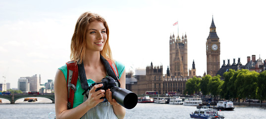 Image showing woman with backpack and camera over london big ben