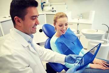 Image showing male dentist with tablet pc and woman patient