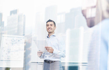 Image showing smiling business people meeting in office