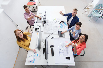 Image showing creative team with computers showing thumbs up