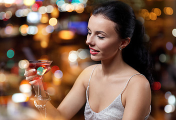 Image showing glamorous woman with cocktail at night club or bar