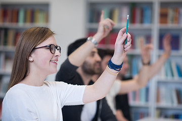 Image showing group of students  raise hands up