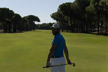 Image showing golf player portrait from back