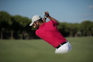 Image showing golfer hitting a sand bunker shot