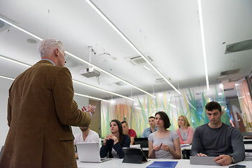 Image showing teacher with a group of students in classroom