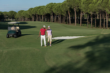 Image showing couple walking on golf course