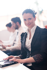 Image showing business woman on meeting  using tablet