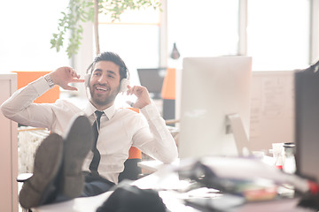 Image showing relaxed young business man at office