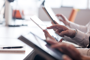 Image showing business people on meeting  using tablet