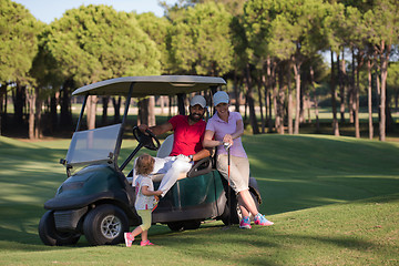 Image showing couple in buggy on golf course