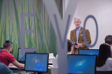 Image showing teacher and students in computer lab classroom