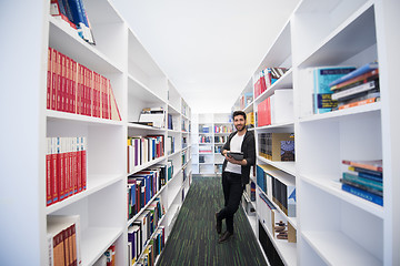 Image showing student with tablet in library