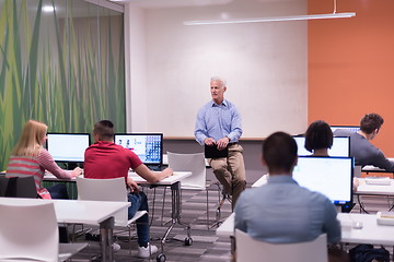 Image showing teacher and students in computer lab classroom