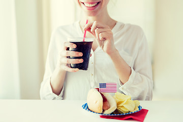 Image showing close up of happy woman drinking cola