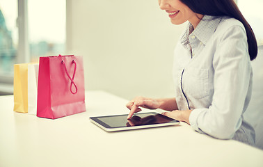 Image showing close up of woman with tablet pc at office