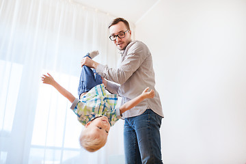 Image showing father with son playing and having fun at home