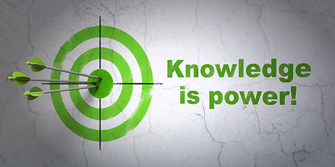 Image showing Education concept: target and Knowledge Is power! on wall background