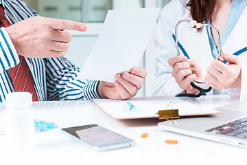 Image showing The patient and his doctor in medical office