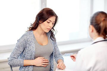 Image showing gynecologist doctor and pregnant woman at hospital