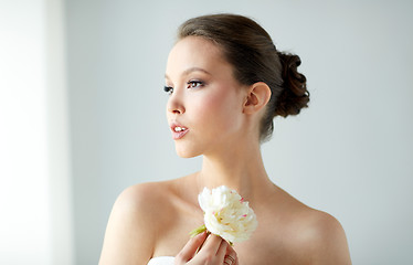 Image showing beautiful asian woman with flower and jewelry