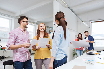 Image showing creative team on coffee break talking at office