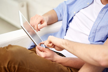 Image showing close up of friends with tablet pc at home