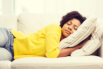 Image showing african young woman sleeping on sofa at home