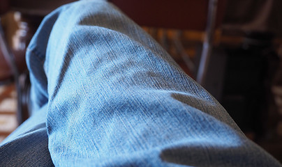 Image showing Blue jeans man sitting