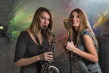 Image showing Young pretty women on stage