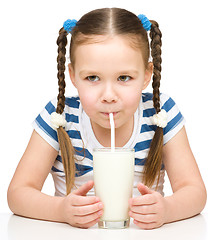 Image showing Cute little girl with a glass of milk