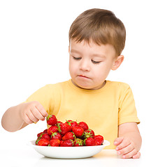 Image showing Little boy with strawberries