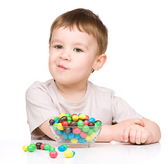 Image showing Portrait of a boy with candies