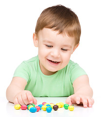 Image showing Portrait of a boy with candies