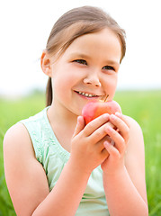 Image showing Portrait of a little girl with apple