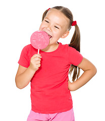 Image showing Little girl with lollipop