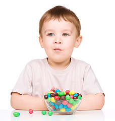 Image showing Portrait of a boy with candies