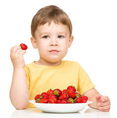 Image showing Little boy with strawberries