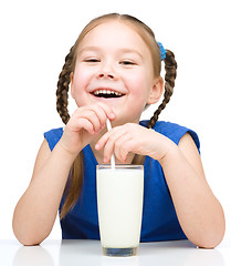 Image showing Cute little girl with a glass of milk